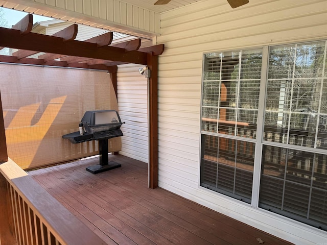 deck with area for grilling and a pergola