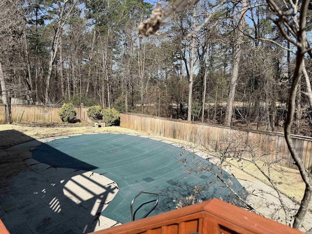 view of swimming pool featuring a fenced backyard