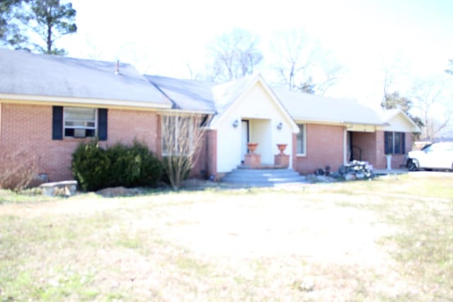 ranch-style house with brick siding