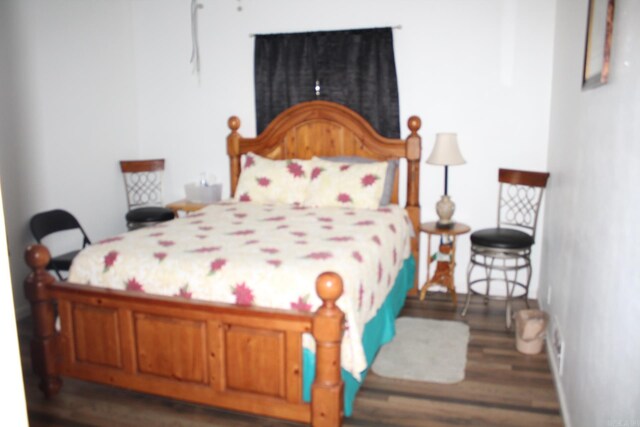 bedroom featuring wood finished floors