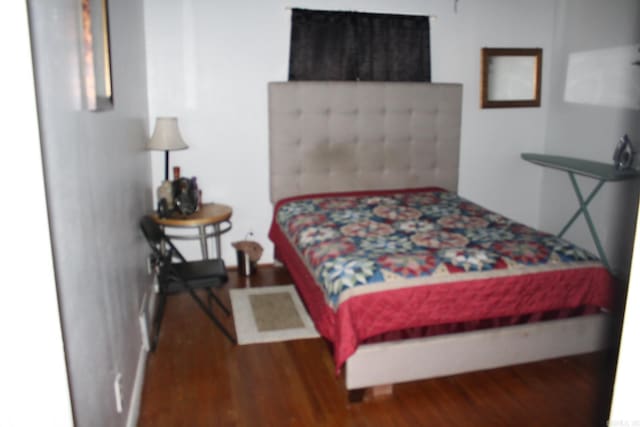 bedroom with wood finished floors