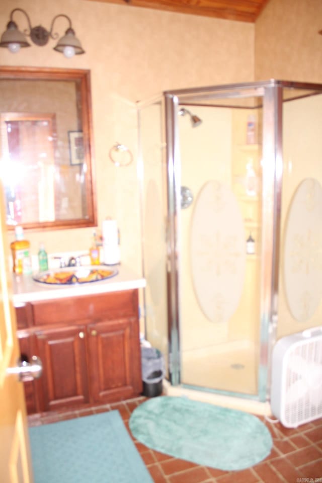 full bath featuring a stall shower and vanity