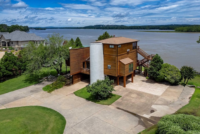 birds eye view of property with a water view