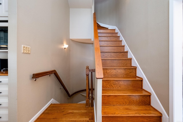 staircase with baseboards