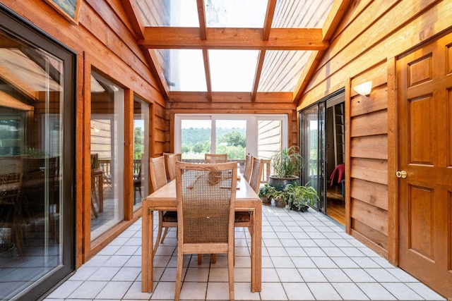 sunroom with lofted ceiling with beams