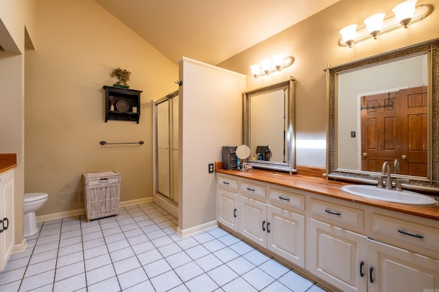 full bath featuring a stall shower, toilet, tile patterned floors, vaulted ceiling, and vanity