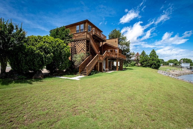 view of yard featuring a deck and stairs