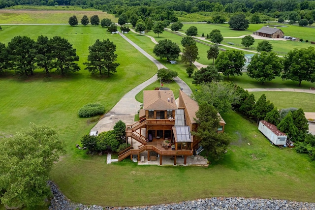 birds eye view of property with a rural view