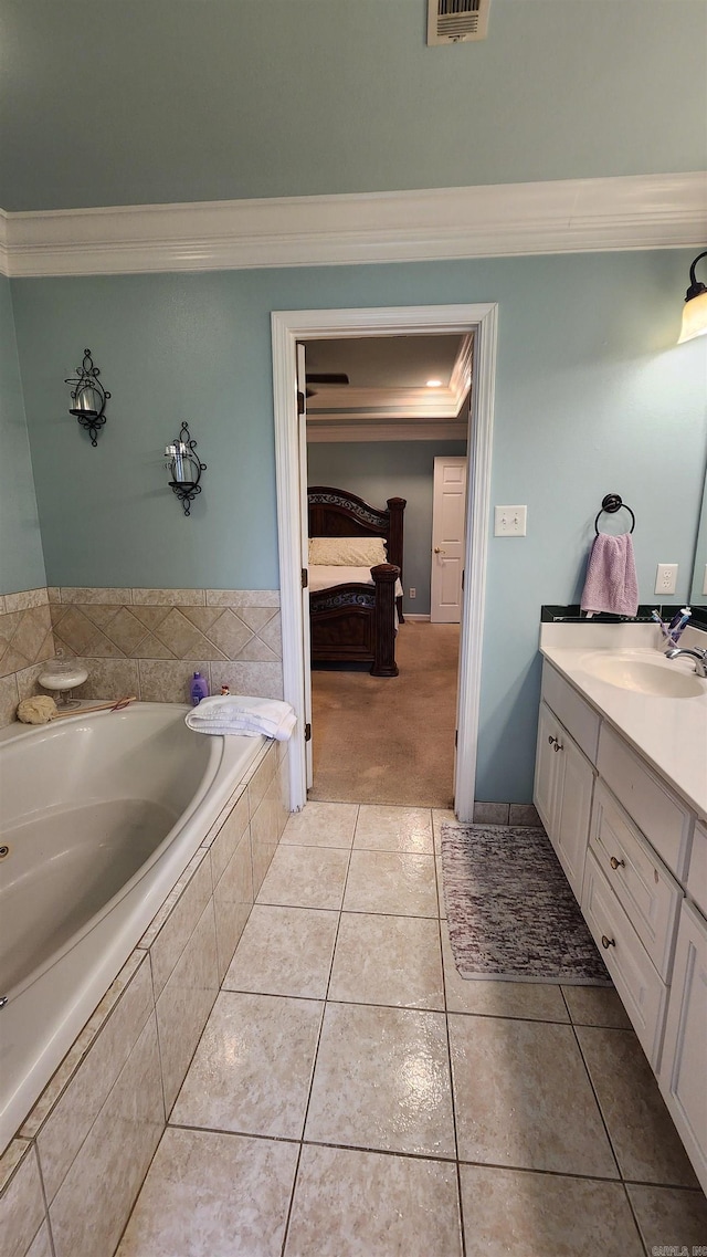 full bath featuring ensuite bathroom, tile patterned flooring, vanity, a bath, and crown molding