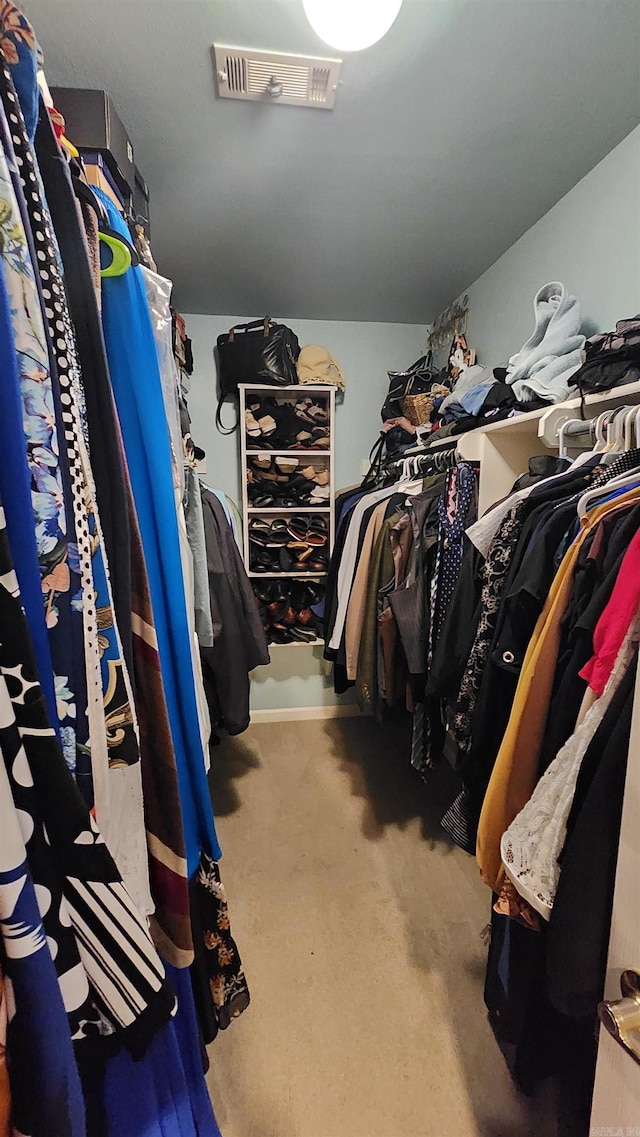 spacious closet with carpet floors and visible vents