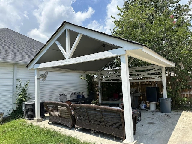 view of patio with central AC, outdoor lounge area, and a gazebo