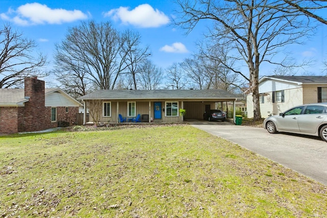 single story home with a carport, a front yard, and driveway