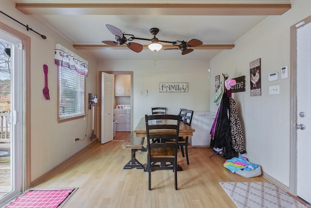 dining space featuring a ceiling fan, light wood-type flooring, washer / clothes dryer, and crown molding