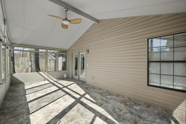 unfurnished sunroom with vaulted ceiling with beams and ceiling fan