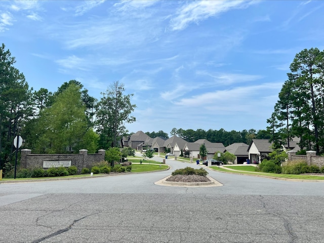 view of street featuring curbs and a residential view