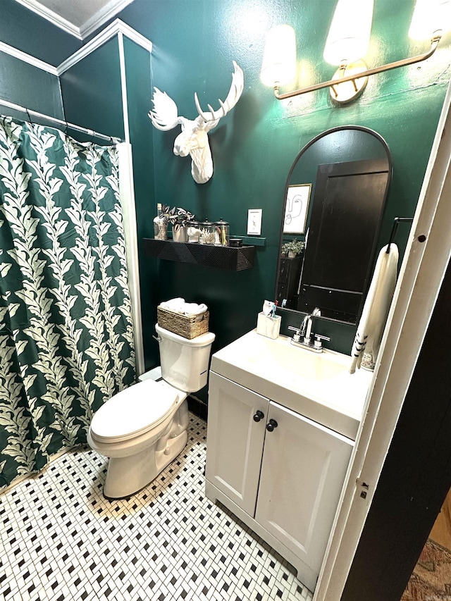 bathroom with a shower with curtain, vanity, toilet, and tile patterned floors