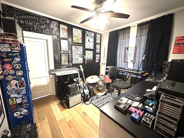 office featuring ceiling fan, crown molding, and wood finished floors