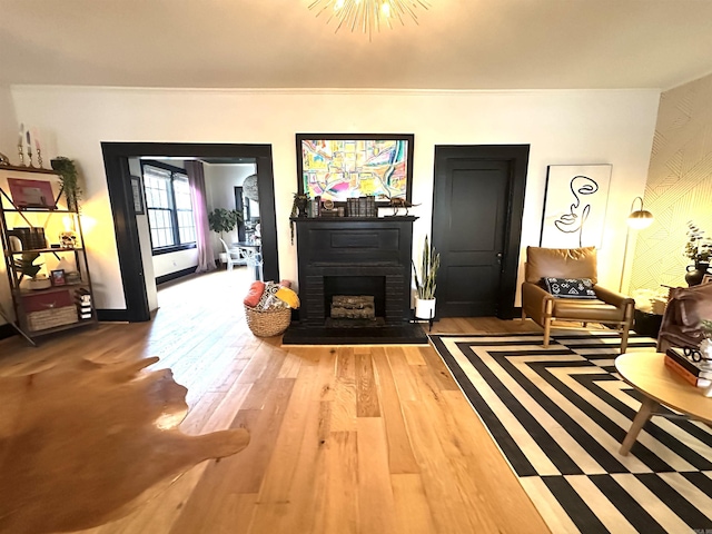 living area with a fireplace and hardwood / wood-style floors