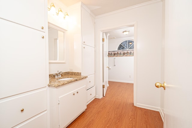 875 Ouachita 64, Camden, AR 71701 - bathroom featuring vanity, wood finished floors, baseboards, and ornamental molding