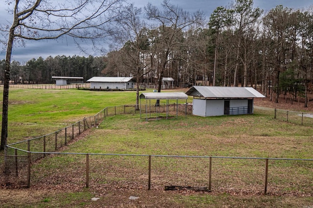 875 Ouachita 64, Camden, AR 71701 - view of yard with an outdoor structure, a wooded view, and fence