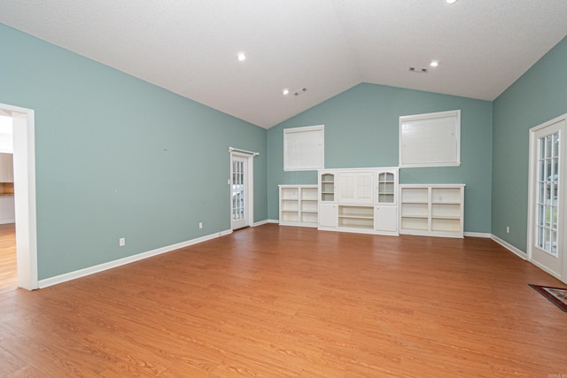 875 Ouachita 64, Camden, AR 71701 - unfurnished living room with baseboards, wood finished floors, and vaulted ceiling