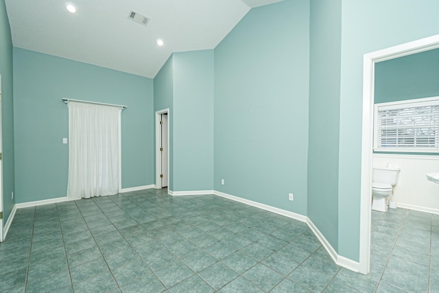 875 Ouachita 64, Camden, AR 71701 - unfurnished bedroom featuring tile patterned flooring, visible vents, ensuite bathroom, and baseboards