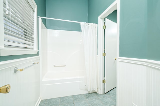 875 Ouachita 64, Camden, AR 71701 - bathroom with tile patterned flooring, a wainscoted wall, and shower / bathtub combination with curtain