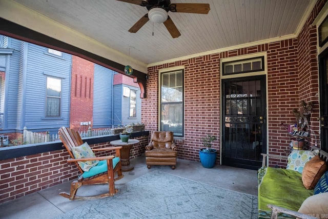 sunroom / solarium with a ceiling fan