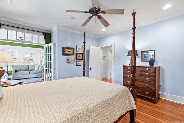 bedroom featuring baseboards, ceiling fan, wood finished floors, crown molding, and recessed lighting