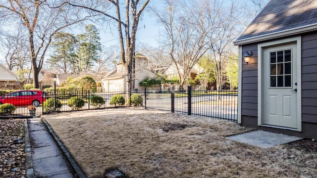 view of yard featuring fence and a residential view