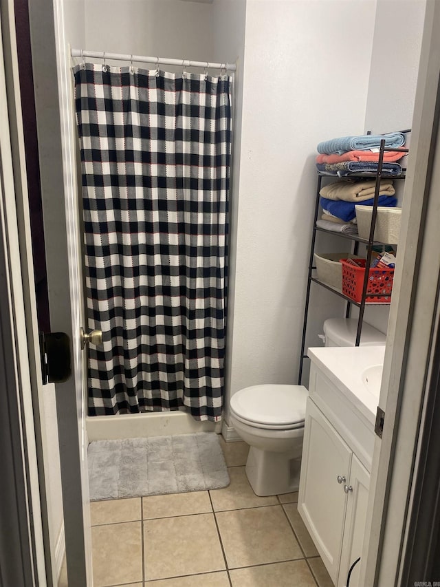full bath with tile patterned flooring, toilet, vanity, and a shower with curtain