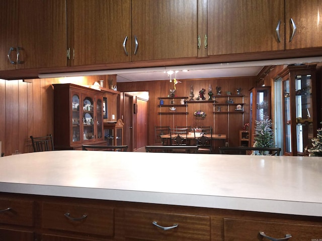 kitchen with wood walls and light countertops