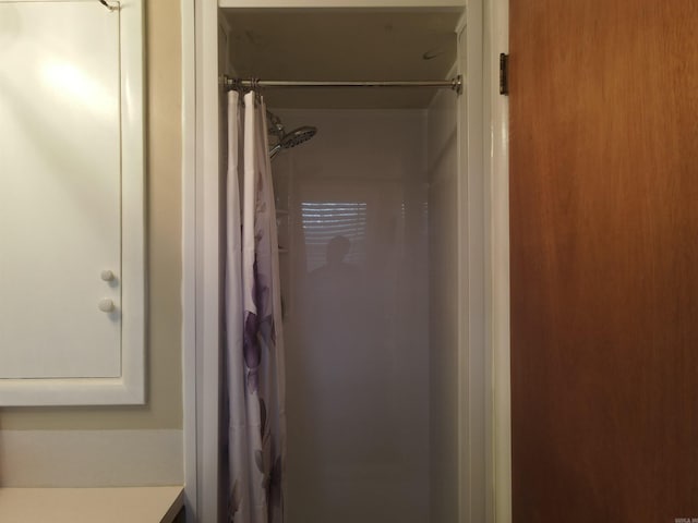 full bathroom featuring vanity and a shower with curtain