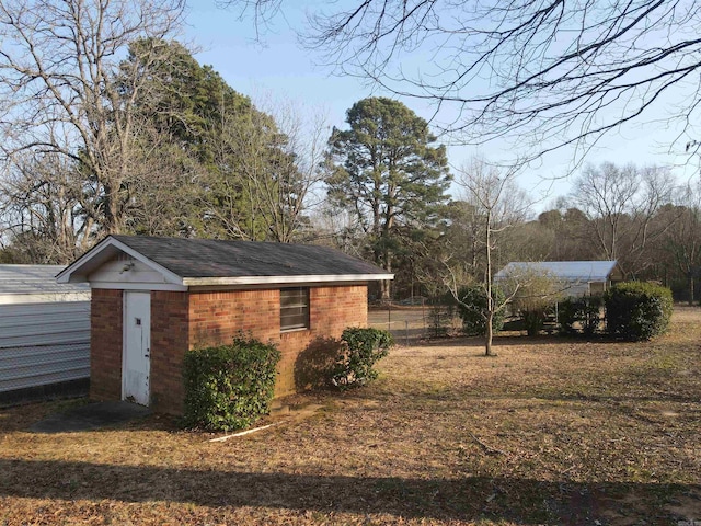 view of shed with fence