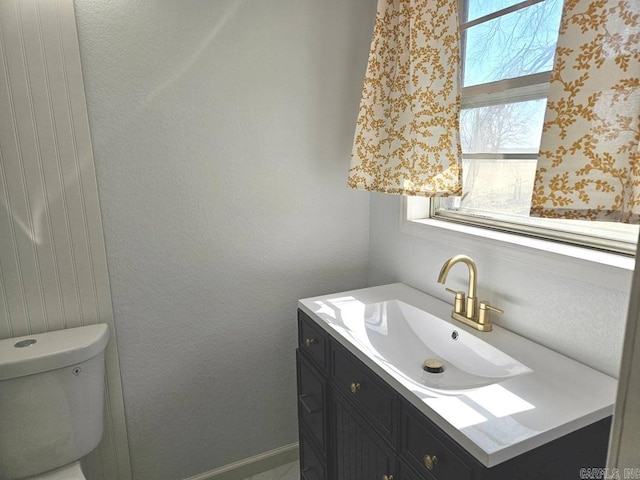 half bath with vanity and toilet