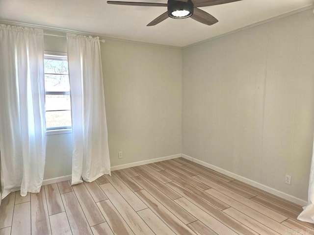 unfurnished room featuring light wood-type flooring, ceiling fan, and baseboards