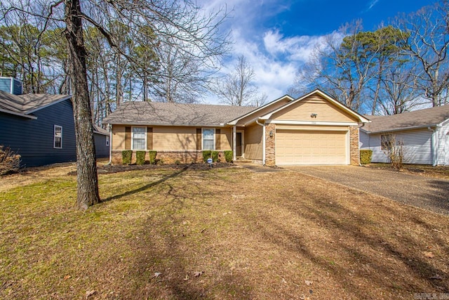 single story home with driveway, an attached garage, a front yard, and brick siding