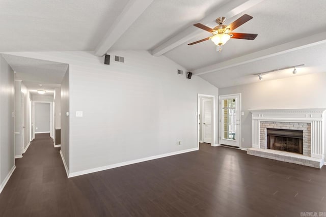 unfurnished living room with dark wood-style floors, a fireplace, vaulted ceiling with beams, visible vents, and baseboards