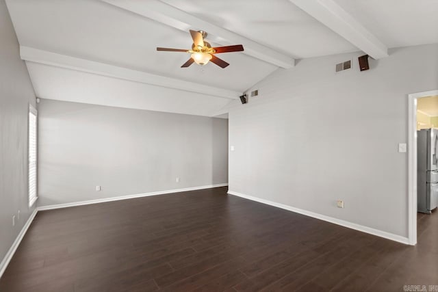 spare room featuring vaulted ceiling with beams, dark wood finished floors, visible vents, and baseboards