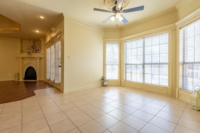 unfurnished living room featuring ornamental molding and tile patterned floors