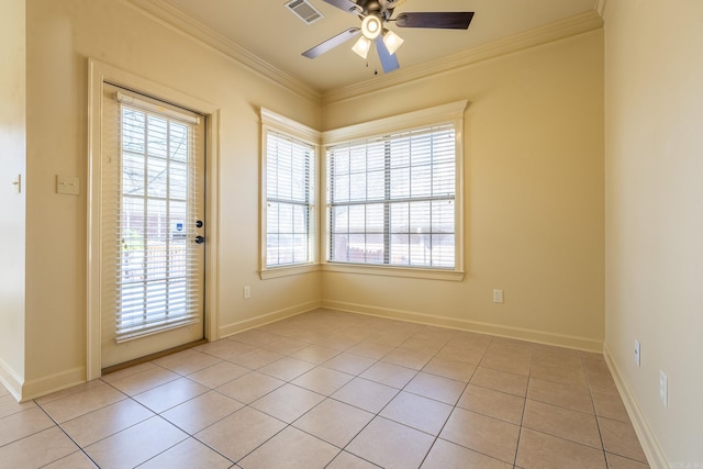 spare room featuring baseboards, visible vents, ceiling fan, crown molding, and light tile patterned flooring