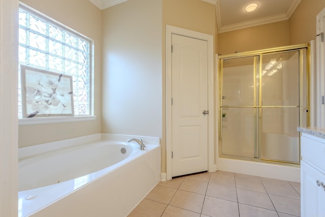 full bathroom featuring a stall shower, a garden tub, plenty of natural light, and tile patterned floors