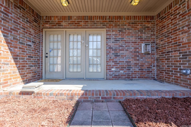 entrance to property with brick siding