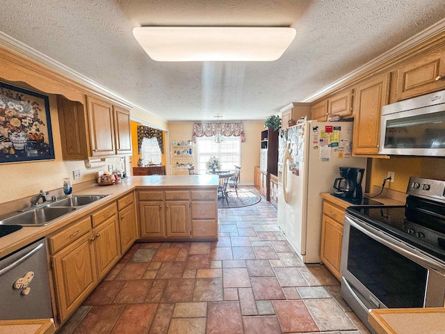 2407 Brittany, Searcy, AR 72143 - kitchen featuring light countertops, appliances with stainless steel finishes, stone finish floor, a sink, and a peninsula