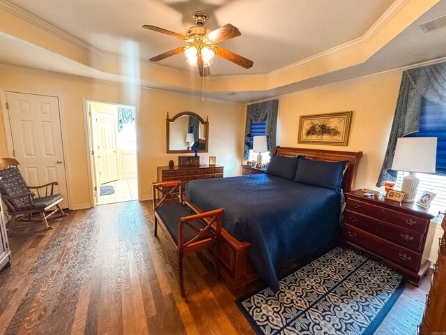2407 Brittany, Searcy, AR 72143 - bedroom with visible vents, crown molding, a tray ceiling, and wood finished floors
