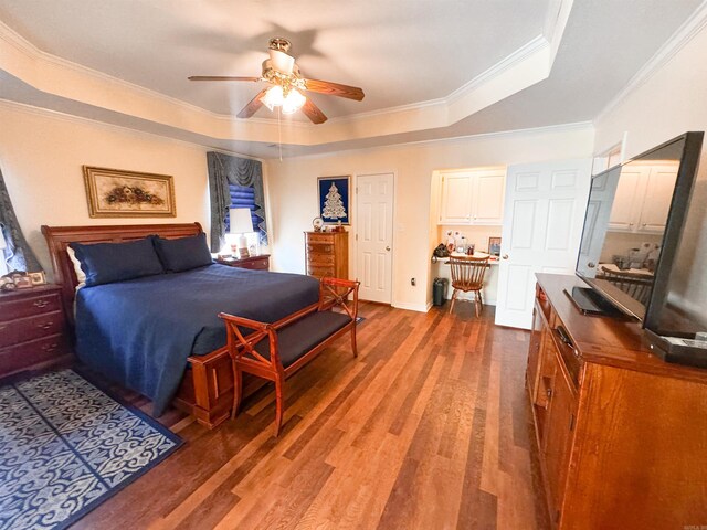 2407 Brittany, Searcy, AR 72143 - bedroom with a ceiling fan, a tray ceiling, crown molding, and wood finished floors