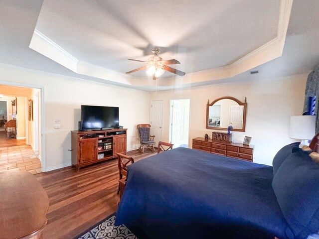 2407 Brittany, Searcy, AR 72143 - bedroom with ornamental molding, wood finished floors, a raised ceiling, and baseboards