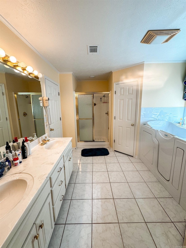 2407 Brittany, Searcy, AR 72143 - full bath featuring a sink, washing machine and dryer, visible vents, and a shower stall