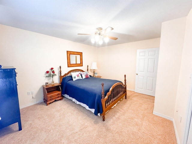 2407 Brittany, Searcy, AR 72143 - bedroom featuring a ceiling fan, light carpet, and baseboards
