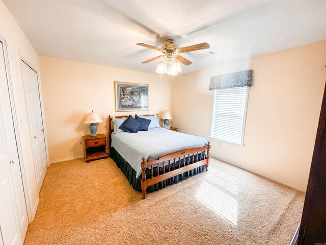 2407 Brittany, Searcy, AR 72143 - bedroom featuring ceiling fan, baseboards, and light colored carpet